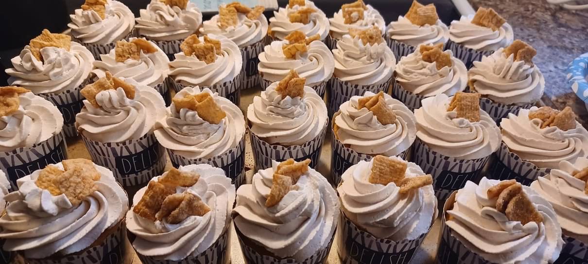 Tray of cupcakes topped with cinnamon cereal pieces
